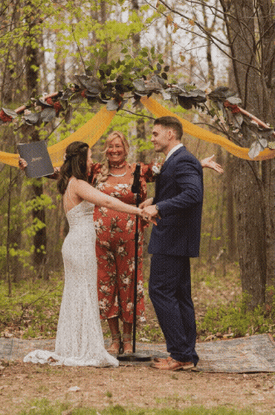 Man In Tuxedo Next To Bride In White Dress GIF