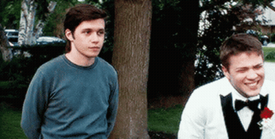 Man In Tuxedo Next To Man In Blue Shirt GIF