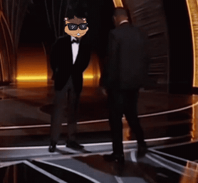 Man In Tuxedo Next To Man In Suit And Tie GIF