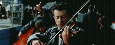Man In Tuxedo Playing Violin In Front Of Crowd GIF