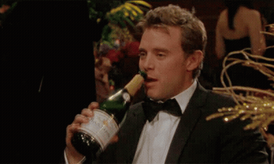Man In Tuxedo Pouring Champagne Into Glass GIF