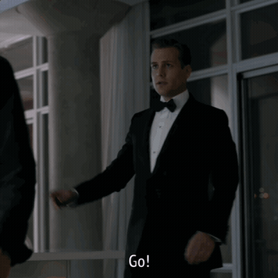 Man In Tuxedo Saying Go In Front Of Window GIF