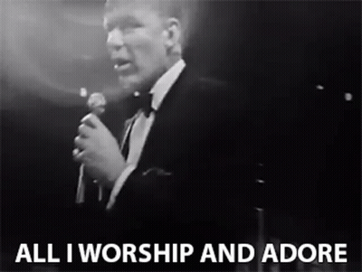Man In Tuxedo Singing All I Worship And Adore GIF