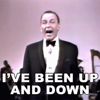 Man in Tuxedo Singing Into Microphone I've Been Up and Down