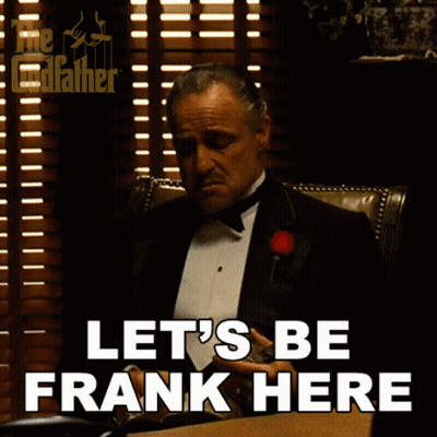 Man In Tuxedo Sitting At Desk Saying Let's Be Frank Here GIF