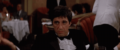 Man In Tuxedo Sitting At Table GIF