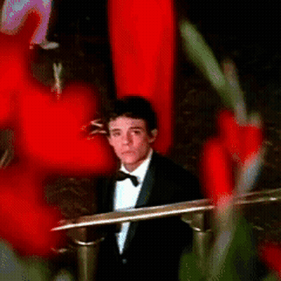 Man In Tuxedo Sitting In Chair GIF