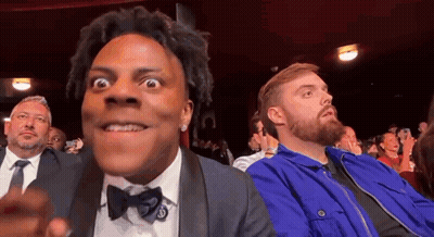 Man In Tuxedo Sitting In Theatre GIF
