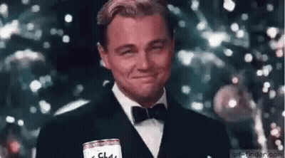 Man In Tuxedo Smiling And Holding Beer Can GIF