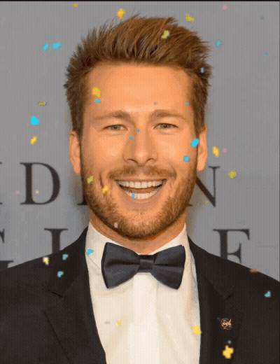 Man In Tuxedo Smiling Beside Letter N GIF