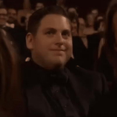 Man In Tuxedo Smiling In Applauding Crowd GIF