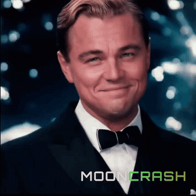 Man in Tuxedo Smiling in Front of Moon Crash Logo