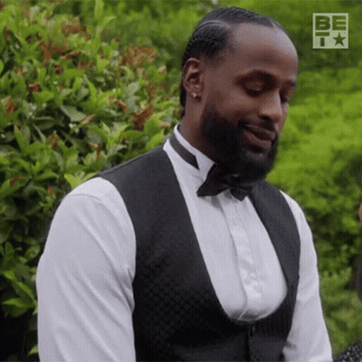 Man In Tuxedo Smiling Looking Down GIF