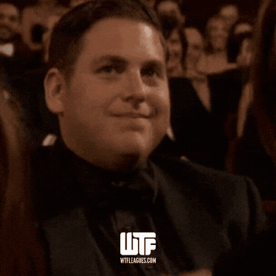 Man In Tuxedo Smiling With WTF GIF