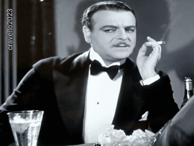 Man In Tuxedo Smoking Cigarette Black And White Photo By Cravello 2023 GIF