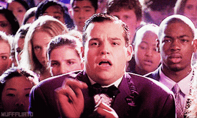 Man In Tuxedo Smoking Cigarette In Crowd Mufffliato GIF
