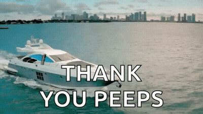 Man In Tuxedo Standing In Front Of White Yacht GIF
