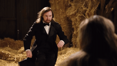 Man In Tuxedo Standing In Hay GIF