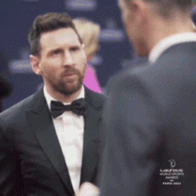 Man In Tuxedo Talking To Another GIF