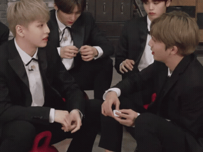 Man In Tuxedo Talking To Suit GIF