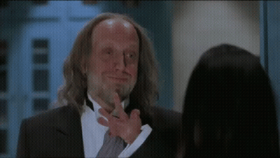 Man In Tuxedo Talking To Woman GIF