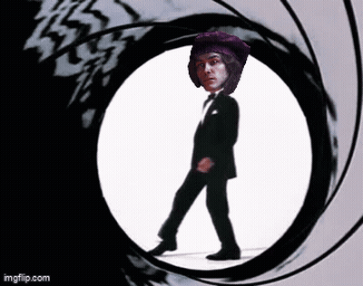 Man In Tuxedo Walking Through Circle Gun Barrel GIF