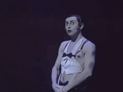 Man In Tuxedo With Bow Tie And Suspenders Making Funny Face GIF