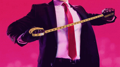 Man In Tuxedo With Bow Tie Looks At Another Man GIF