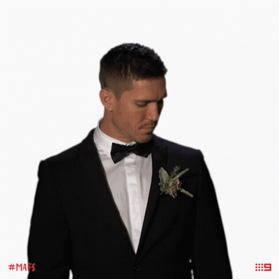 Man In Tuxedo With Flower And Number 9 GIF
