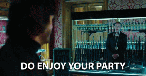 Man In Tuxedo With Guns And Do Enjoy Your Party GIF