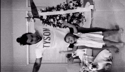 Man In Tyson T-Shirt Holding Two Children GIF