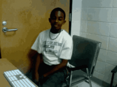 Man In U.S. Army Shirt At Computer GIF