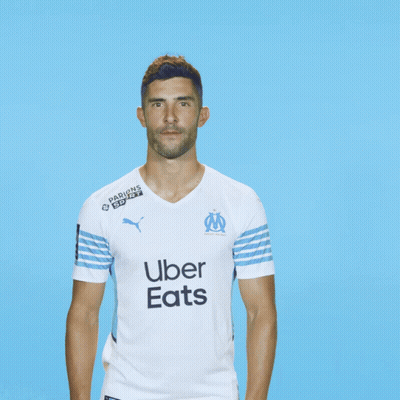 Man In Uber Eats Shirt On Blue Background GIF