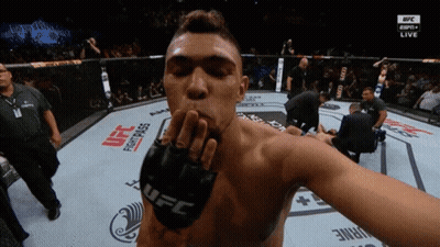 Man In UFC Glove Blows Kiss In Boxing Ring GIF
