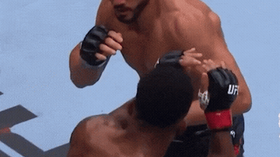 Man In UFC Gloves Fighting Another Man GIF