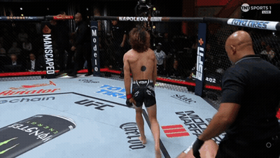 Man in UFC Ring With Monster Can