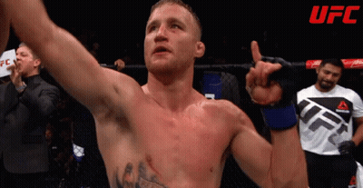 Man In UFC Shirt Holding Hand Up GIF