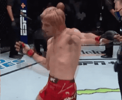 Man In UFC Shorts In Front Of ESPN Banner GIF
