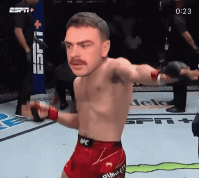 Man In UFC Shorts In Front Of ESPN+ Sign GIF
