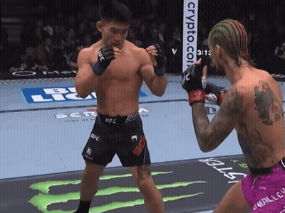 Man In UFC Shorts Next To Another Man GIF