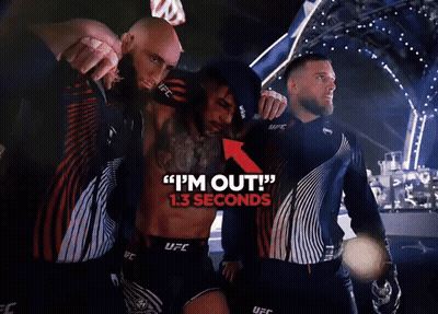 Man In UFC Uniform Helping Another GIF