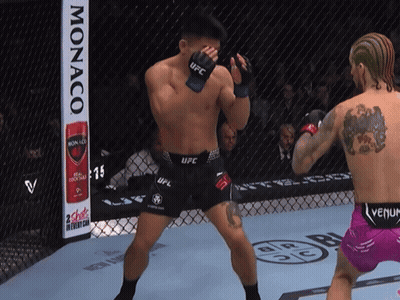Man In UFC Uniform With Monaco Can GIF