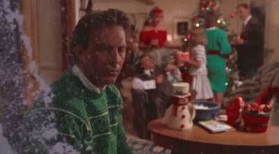 Man In Ugly Christmas Sweater By Tree GIF