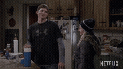Man In Under Armour Shirt Next To Woman GIF