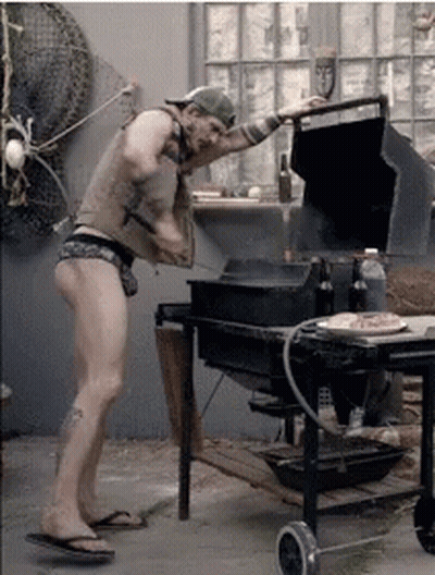 Man In Underwear Standing By Grill GIF