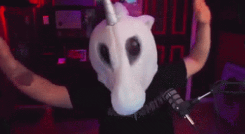 Man In Unicorn Mask At Microphone GIF