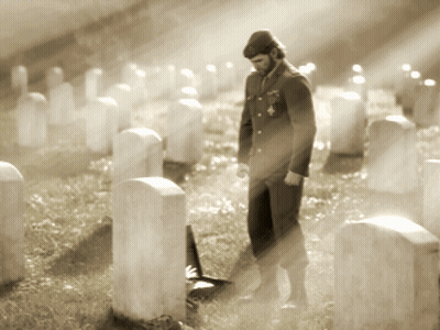 Man In Uniform Among Graves In Cemetery GIF