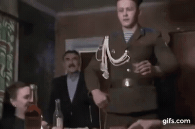 Man In Uniform Holding Shot Glass With Group GIF