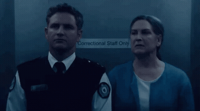 Man In Uniform Standing Before Personal Staff Only Door GIF