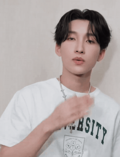 Man In University T-Shirt With Necklace GIF